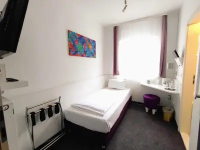 Ein Bett oder Betten in einem Zimmer der Unterkunft Les Nations