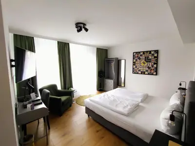 Ein Bett oder Betten in einem Zimmer der Unterkunft Les Nations