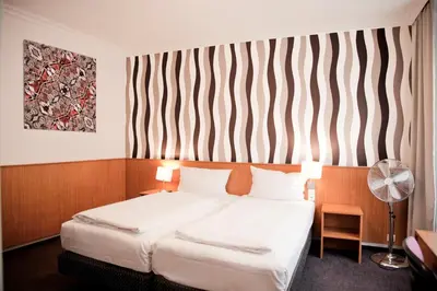 Ein Bett oder Betten in einem Zimmer der Unterkunft Les Nations