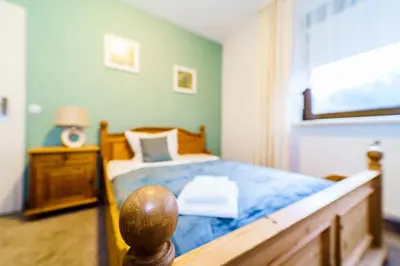 Ein Bett oder Betten in einem Zimmer der Unterkunft Bestwaner Hotel