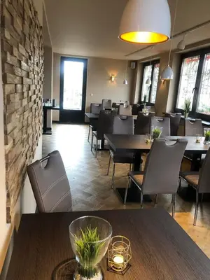 Ein Sitzbereich in der Unterkunft Bestwaner Hotel