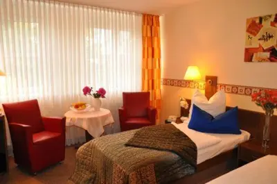 Ein Bett oder Betten in einem Zimmer der Unterkunft Hotel 4 Hufen