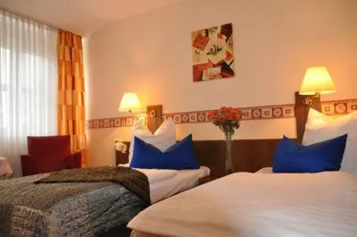 Ein Bett oder Betten in einem Zimmer der Unterkunft Hotel 4 Hufen