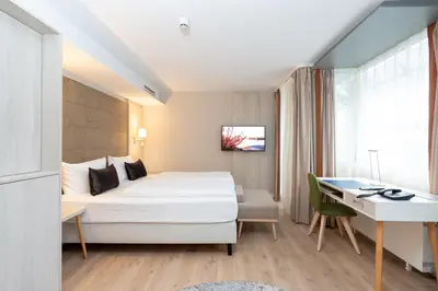 Ein Bett oder Betten in einem Zimmer der Unterkunft Kongresshotel Potsdam am Templiner See
