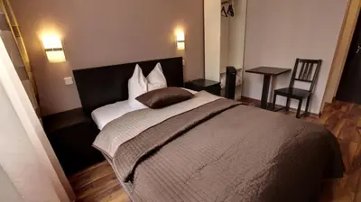 Ein Bett oder Betten in einem Zimmer der Unterkunft Pension ABC