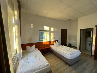 Ein Bett oder Betten in einem Zimmer der Unterkunft Hotel Birkenwerder