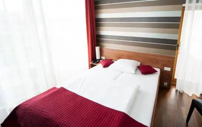Ein Bett oder Betten in einem Zimmer der Unterkunft Hotel zum Hofmaler