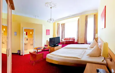 Ein Bett oder Betten in einem Zimmer der Unterkunft Hotel Vivaldi Berlin am Kurfürstendamm
