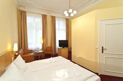 Ein Bett oder Betten in einem Zimmer der Unterkunft Hotel Vivaldi Berlin am Kurfürstendamm