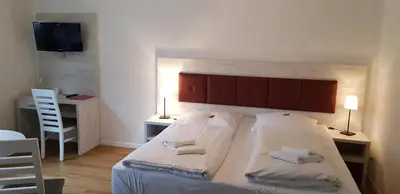 Ein Bett oder Betten in einem Zimmer der Unterkunft Hotel & Restaurant Lindengarten