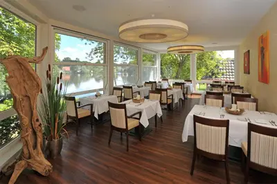 Ein Restaurant oder anderes Speiselokal in der Unterkunft Leutloff's am See
