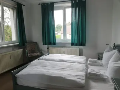 Ein Bett oder Betten in einem Zimmer der Unterkunft Leutloff's am See