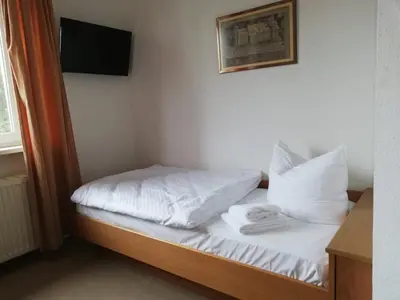 Ein Bett oder Betten in einem Zimmer der Unterkunft Leutloff's am See