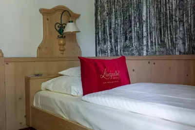 Ein Bett oder Betten in einem Zimmer der Unterkunft Landgasthof zum Mühlenteich