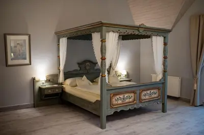 Ein Bett oder Betten in einem Zimmer der Unterkunft Landgasthof zum Mühlenteich