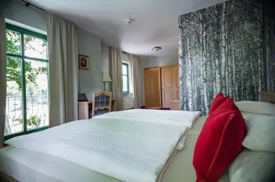 Ein Bett oder Betten in einem Zimmer der Unterkunft Landgasthof zum Mühlenteich