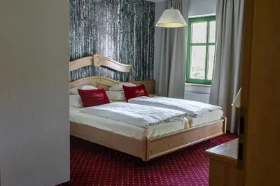 Ein Bett oder Betten in einem Zimmer der Unterkunft Landgasthof zum Mühlenteich
