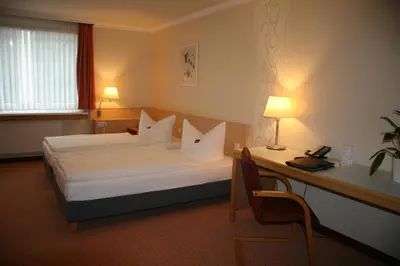 Ein Bett oder Betten in einem Zimmer der Unterkunft Bildungszentrum Erkner