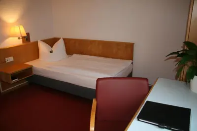 Ein Bett oder Betten in einem Zimmer der Unterkunft Bildungszentrum Erkner