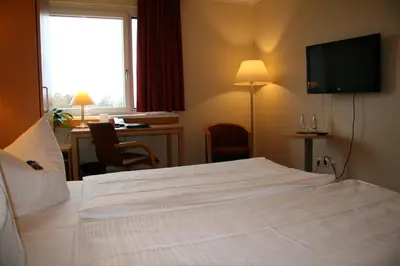 Ein Bett oder Betten in einem Zimmer der Unterkunft Bildungszentrum Erkner