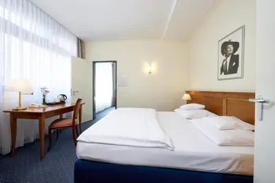 Ein Bett oder Betten in einem Zimmer der Unterkunft Hollywood Media Hotel am Kurfürstendamm