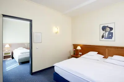 Ein Bett oder Betten in einem Zimmer der Unterkunft Hollywood Media Hotel am Kurfürstendamm
