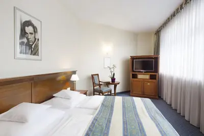 Ein Bett oder Betten in einem Zimmer der Unterkunft Hollywood Media Hotel am Kurfürstendamm
