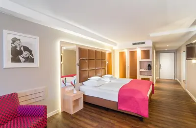 Ein Bett oder Betten in einem Zimmer der Unterkunft Hollywood Media Hotel am Kurfürstendamm