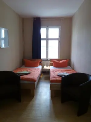 Ein Bett oder Betten in einem Zimmer der Unterkunft Apartmentpension am Stadtschloss