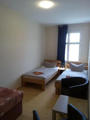 Ein Bett oder Betten in einem Zimmer der Unterkunft Apartmentpension am Stadtschloss