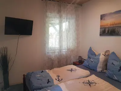 Ein Bett oder Betten in einem Zimmer der Unterkunft Ferienhaus an den Moorwiesen