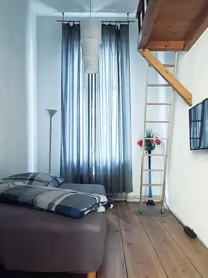 Ein Bett oder Betten in einem Zimmer der Unterkunft Ruhige Ferienwohnung in Kreuzberg