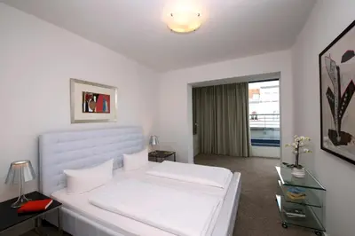 Ein Bett oder Betten in einem Zimmer der Unterkunft Art'Appart Suiten - kontaktloser Check-In