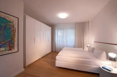 Ein Bett oder Betten in einem Zimmer der Unterkunft Art'Appart Suiten - kontaktloser Check-In