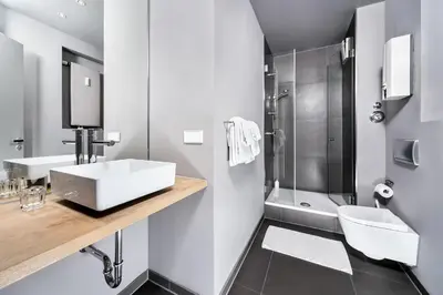 Ein Badezimmer in der Unterkunft Art'Appart Suiten - kontaktloser Check-In