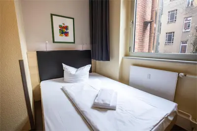 Ein Bett oder Betten in einem Zimmer der Unterkunft acama Hotel & Hostel Kreuzberg