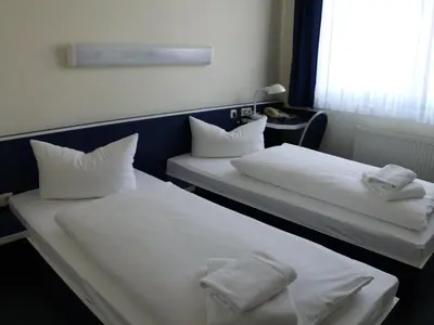 Ein Bett oder Betten in einem Zimmer der Unterkunft Central-Hotel Eberswalde