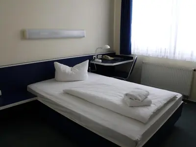 Ein Bett oder Betten in einem Zimmer der Unterkunft Central-Hotel Eberswalde