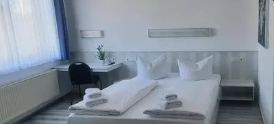 Ein Bett oder Betten in einem Zimmer der Unterkunft Central-Hotel Tegel
