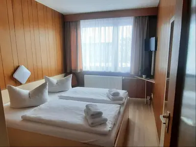 Ein Bett oder Betten in einem Zimmer der Unterkunft Central-Hotel Tegel