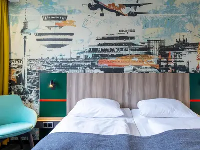 Ein Bett oder Betten in einem Zimmer der Unterkunft Good Morning Berlin City West