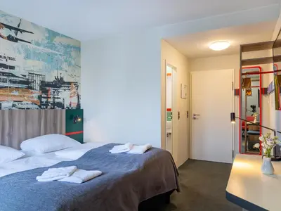 Ein Bett oder Betten in einem Zimmer der Unterkunft Good Morning Berlin City West