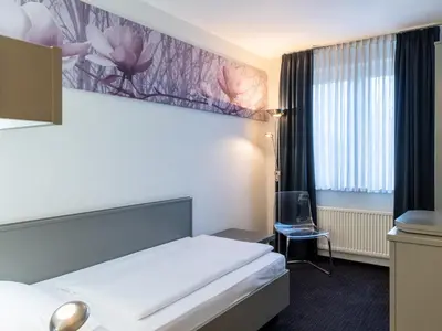 Ein Bett oder Betten in einem Zimmer der Unterkunft Good Morning Berlin City West