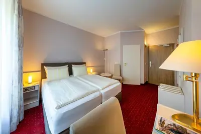 Ein Bett oder Betten in einem Zimmer der Unterkunft Hotel Weiss
