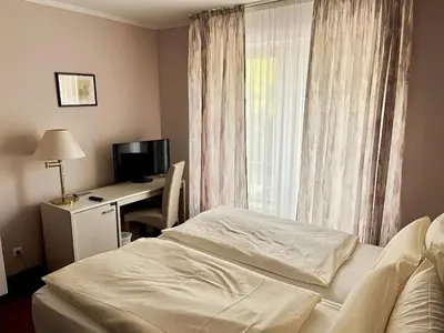 Ein Bett oder Betten in einem Zimmer der Unterkunft Hotel Weiss