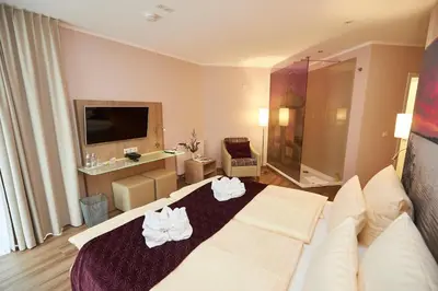 Ein Bett oder Betten in einem Zimmer der Unterkunft Hotel Weiss
