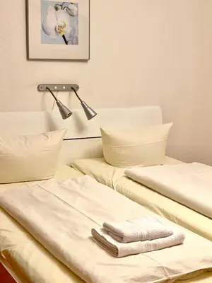 Ein Bett oder Betten in einem Zimmer der Unterkunft Hotel Arena Rooms - Berlin Mitte
