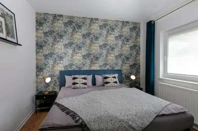 Ein Bett oder Betten in einem Zimmer der Unterkunft charmantes Townhaus mit Garten, W-LAN & Netflix