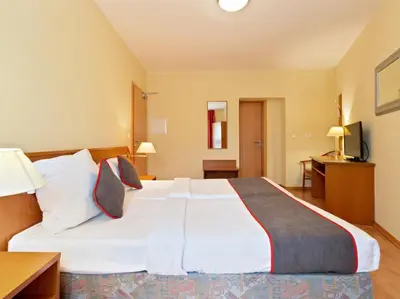 Ein Bett oder Betten in einem Zimmer der Unterkunft Hotel Bohemia