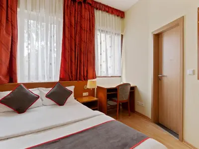 Ein Bett oder Betten in einem Zimmer der Unterkunft Hotel Bohemia